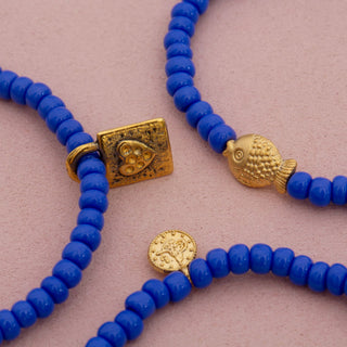 Dara Navy Blue Glass Bead Bracelet with Gold Pendant