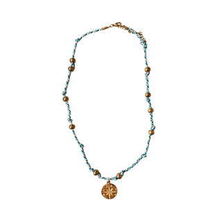 Necklace with beads and a pendant on a white background